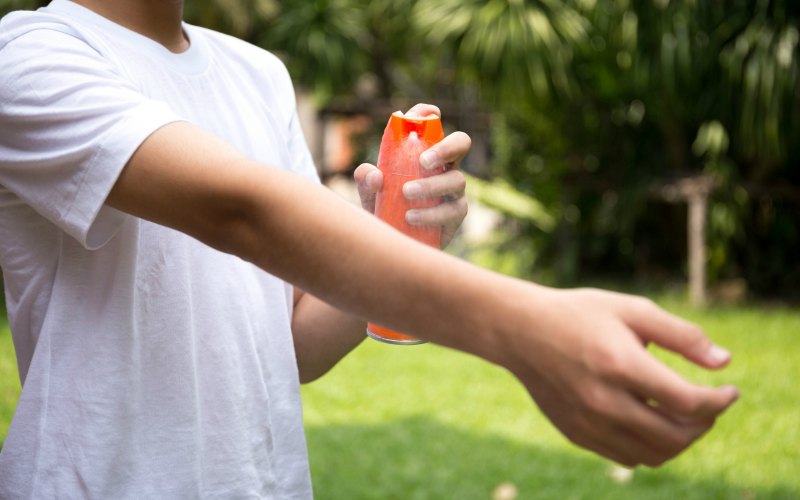 applying bug spray